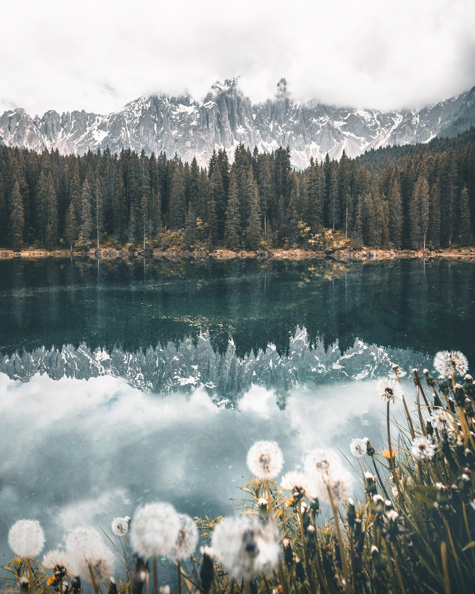 snowy-mountains-reflected-in-still-lake.jpg
