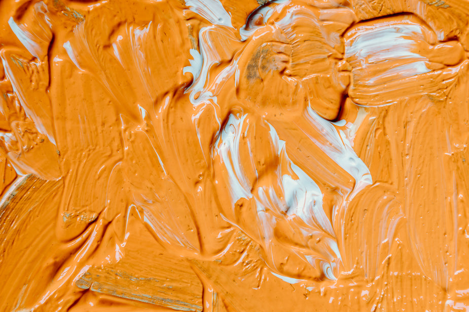 wet-orange-and-white-paint-filling-frame.jpg