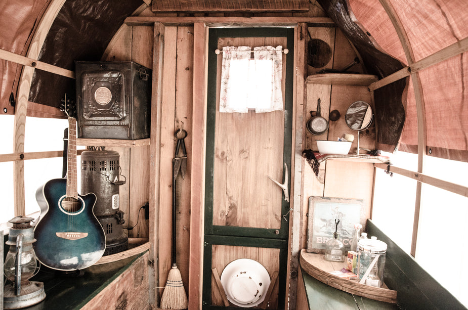 musical-and-rustic-domestic-objects-inside-a-caravan.jpg